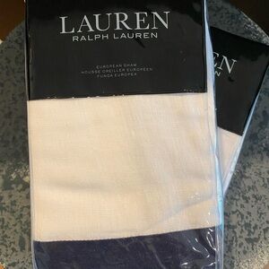 Pair of Lauren Ralph Lauren European Shams white with navy trim.